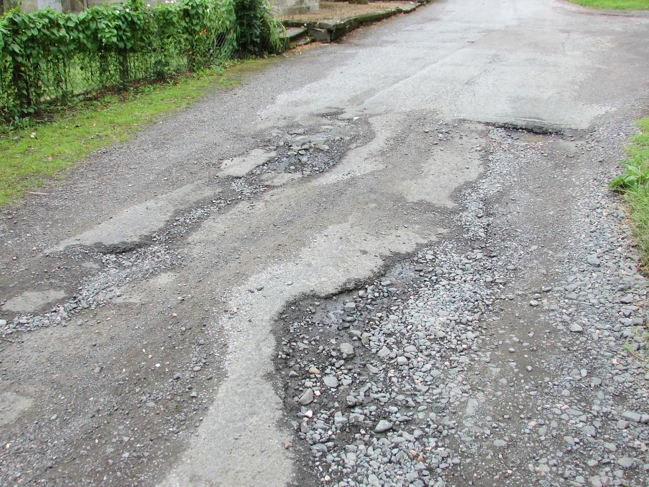 Road debris and pothole damage on a Miami-Dade highway